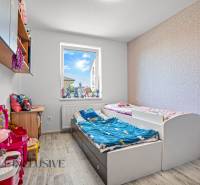Children's room with two beds and toys in a family house.