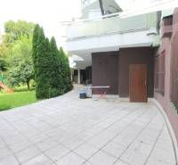 Terrace of commercial premises on Žatevná Street in Bratislava - Dúbravka, with a children's playground.