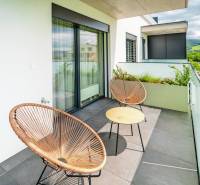 Balcony in a 3-room apartment on Dlhé lúky street, Púchov, with a view of greenery.
