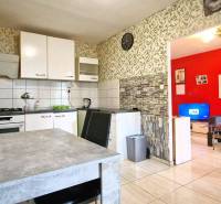 Kitchen with dining table, view into the living room, 3-room apartment.