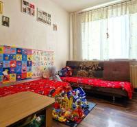Children's room in a 3-room apartment with toys and colorful wall decorations.