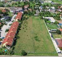 Aerial view of development plots in Miloslavov on Slnečná Street, surrounded by family houses.