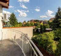 A balcony of a family house on Hattalova Street in Bratislava - Nové Mesto, with a view of the garden.