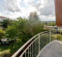 A balcony of a family house on Hattalova Street in Bratislava - Nové Mesto with a view of greenery.