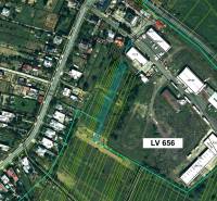 Aerial map of agricultural and forest lands in Topoľovka with plotted parcels and buildings.