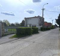 A peaceful street with greenery suitable for residential plots in Sládkovičovo.