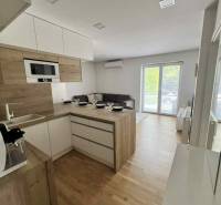 The 3-room apartment includes a kitchenette with a dining table and a living room.