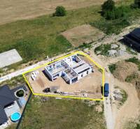 Construction of a family house in Trenčianske Jastrabie, surrounded by nature and other buildings.