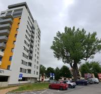 High-rise residential building and parking lot on Štefánikova Street in Poprad.