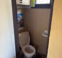 Toilet with sink in the interior near plots - housing.