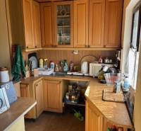 Kitchen unit with wooden cabinets full of kitchen utensils, suitable for Properties - living.