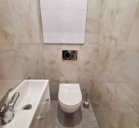 Bathroom in a 2-room apartment with a toilet and a sink.