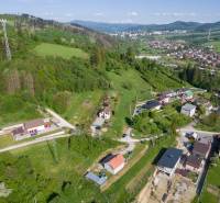 An aerial photograph shows extensive residential land in the village of Raková.
