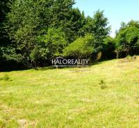 Lands - housing in Pernek, forested area and grassy meadow.