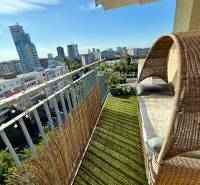 A balcony with comfortable seating in a 2-room apartment on Jégého Street in Bratislava - Ružinov.