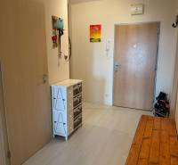 Entrance hall with a wardrobe and a wooden table in a 2-room apartment.