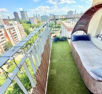 A balcony of a 2-room apartment with a view of the Bratislava skyline on Jégého Street.