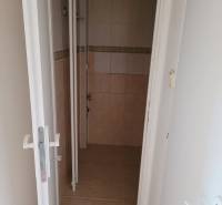 Bathroom with tiles and wall tiles in a 3-room apartment.