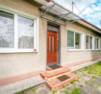 A family house on Pavla Koyša Street in Ladce with white windows and doors.