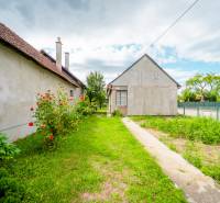 Family house on Pavla Koyša in Ladce with yards and flowers.