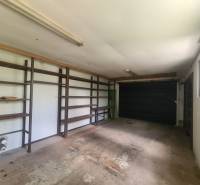 Garage with shelves and a gate in a family house.