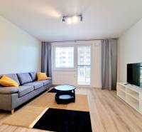 Living room with a sofa and a television in a 3-room apartment.