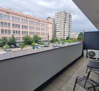 A balcony from a 2-room apartment on Miletičova, Bratislava - Ružinov, with a view of the parking lot.