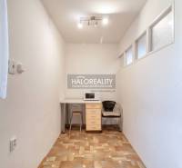 A cozy space with a microwave and a window in a 3-room apartment.