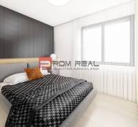 A bedroom in a two-room apartment with a black wall, a bed, and a nightstand with decorations.