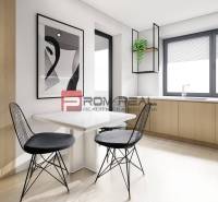 A bright kitchen in a 2-room apartment with black chairs and a painting on the wall.