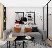 Living room in a two-room apartment with a large sofa and modern decorations.