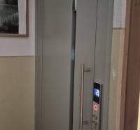 Entrance to the elevator in a 3-room apartment, with details of the control panel.