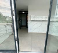 Entrance area with mailboxes in the building on Dúhová Street in Slovenský Grob.