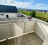 The balcony of a 3-room apartment on Dúhová Street in Slovenský Grob with a view of the surroundings.