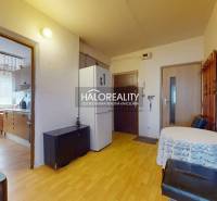 Interior of a 4-room apartment, kitchen with dining area, hallway with refrigerator.