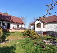 A family house with a garden and a fire pit in the yard, ideal for relaxation.