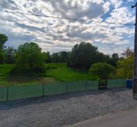 A grassy plot with fencing and trees on Recreational Lands in Záhorce, Selešťany Street.