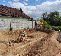 A yard with an excavation and a pile of bricks on the Recreational Grounds in Selešťany in Záhorce.