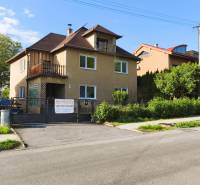A family house on Partizánska Street in Malý Krtíš with a garage and a garden.
