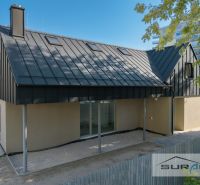 A family house on Železničná Street in Bratislava - Ružinov with a modern roof and fence.