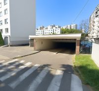 Entrance to the garages on Ondavská Street in Bratislava - Nivy surrounded by apartment buildings.