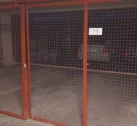 Garages with metal gates and cars in the background on Ondavská in Bratislava - Nivy.