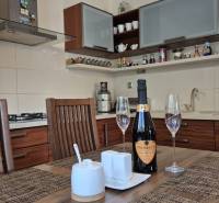 A kitchen in a family house with wooden decor and stylish equipment.