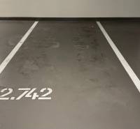 Parking space inside the Garage with number 2.742 and white lines.