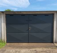 Garages on Legionárska Street in Trenčín with black and blue doors.