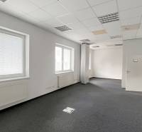 Offices with windows, carpeted floors, and white walls, suitable for administrative purposes.