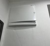 White electrical panel in a 3-room apartment.