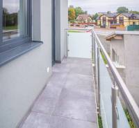 A balcony with tiles in a 2-room apartment with a view of Kukučínova Street in Poprad.