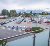 View of the parking lot and the High Tatras from the balcony of a 2-room apartment on Kukučínova Street in Poprad.