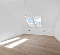 Attic room with wooden floor and skylights, on Trnavská cesta street.